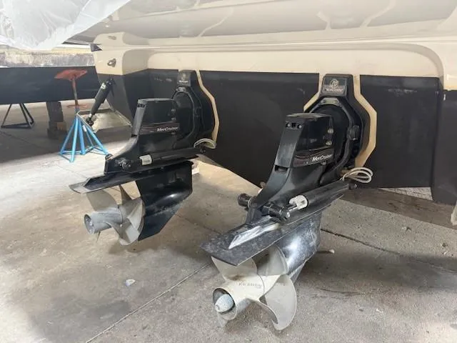 Slide: The Image of Dual propellers of a 2013 Monterey 340 Sport Yacht in a maintenance area. - 20