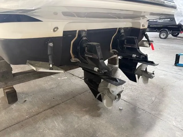 Slide: The Image of 2013 Monterey 340 Sport Yacht dual propellers in a garage setting. - 21