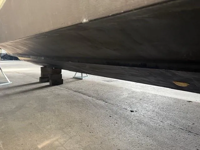 Slide: The Image of Bottom view of a 2013 Monterey 340 Sport Yacht on dry dock. - 22