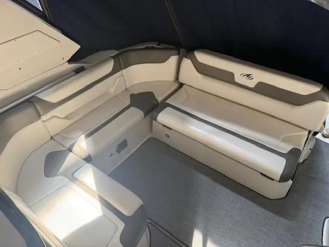 Slide: The Image of Interior seating of 2013 Monterey 340 Sport Yacht, featuring white and gray upholstery. - 26