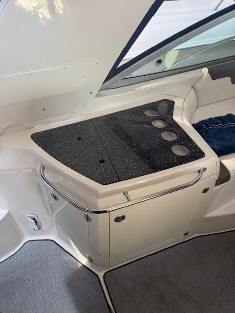 Slide: The Image of 2013 Monterey 340 Sport Yacht interior with sleek countertop and cup holders. - 28