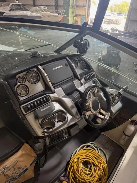 Slide: The Image of 2013 Monterey 340 Sport Yacht dashboard with navigation controls and steering wheel. - 30