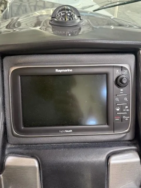 Slide: The Image of Raymarine display on 2013 Monterey 340 Sport Yacht dashboard, featuring advanced navigation controls. - 32