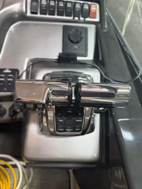 Slide: The Image of Control panel of a 2013 Monterey 340 Sport Yacht with throttle levers and switches. - 33