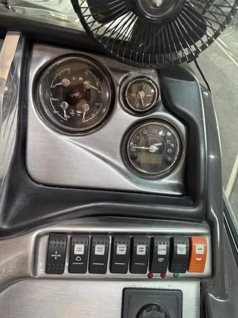 Slide: The Image of Dashboard of a 2013 Monterey 340 Sport Yacht with gauges and control switches. - 34