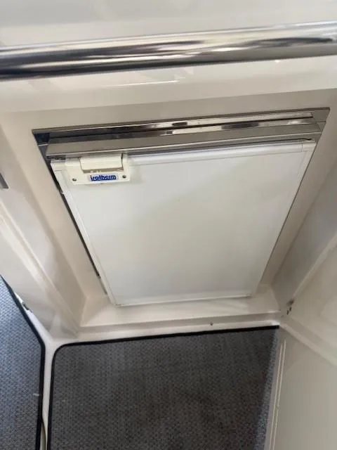 Slide: The Image of 2013 Monterey 340 Sport Yacht interior with compact refrigerator. - 38