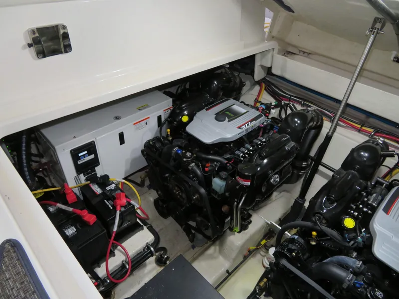 Slide: The Image of Engine compartment of a 2013 Monterey 340 Sport Yacht, showcasing dual engines and electrical systems. - 43