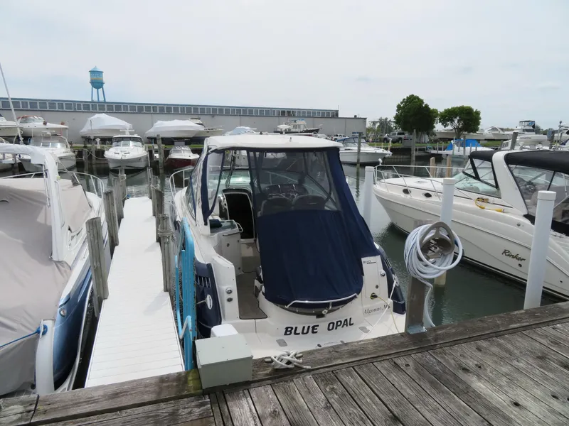 Slide: The Image of Monterey 340 Sport Yacht 2013 docked at marina, surrounded by other boats. - 45