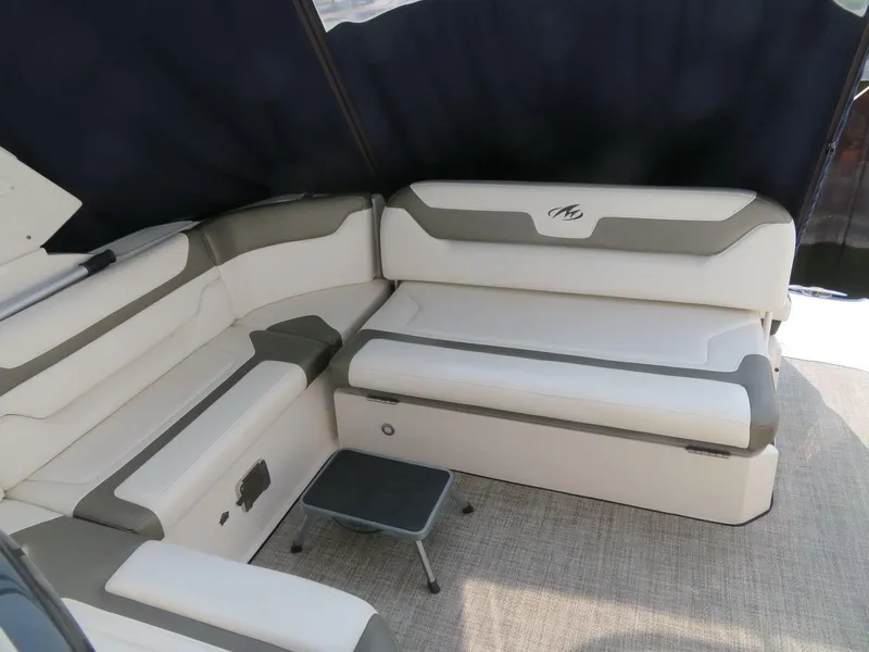 Slide: The Image of 2013 Monterey 340 Sport Yacht interior with beige seating and small table. - 7