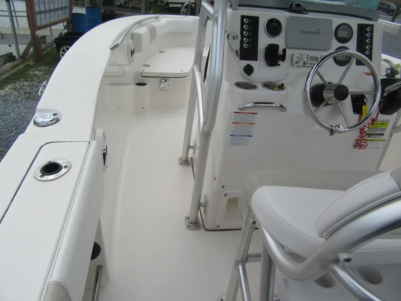 Slide: The Image of 2014 Robalo R200 Center Console boat interior with steering wheel and seating. - 11
