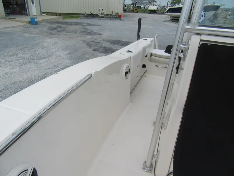 Slide: The Image of 2014 Robalo R200 Center Console boat interior, featuring sleek white design and spacious layout. - 12