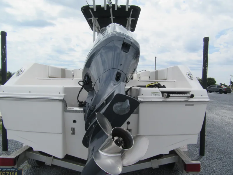 Slide: The Image of 2014 Robalo R200 Center Console boat with outboard motor on trailer. - 13
