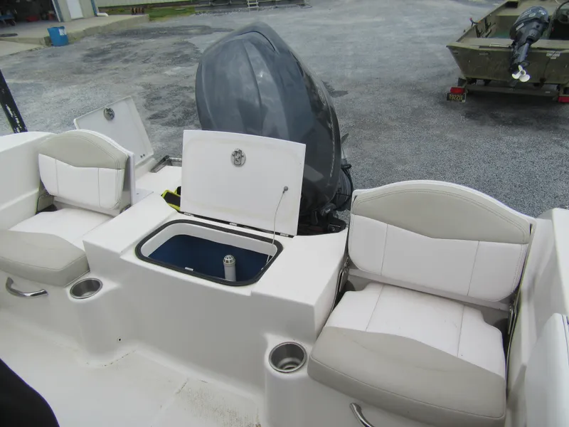 Slide: The Image of 2014 Robalo R200 Center Console boat interior with seating and storage compartments. - 3