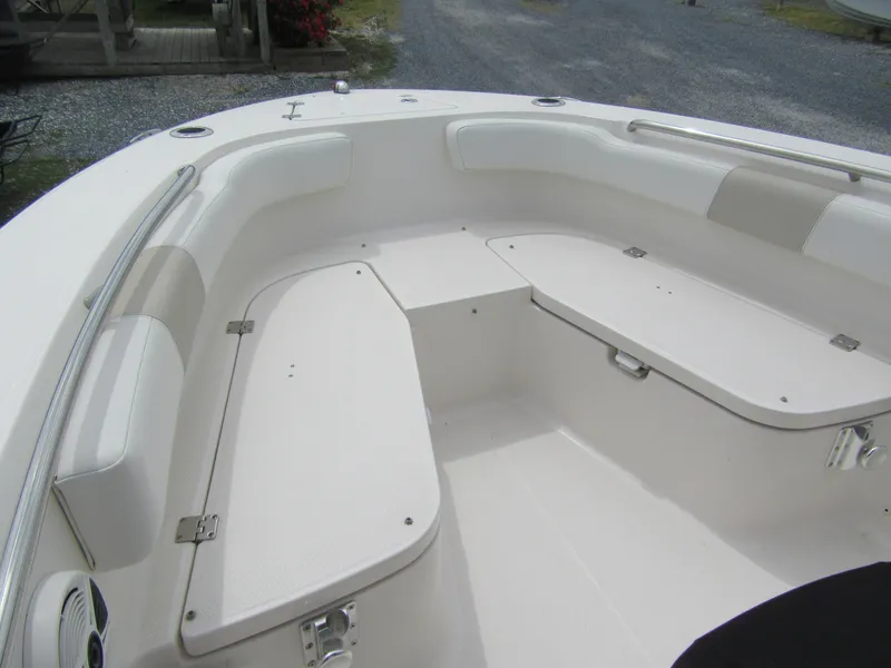Slide: The Image of 2014 Robalo R200 Center Console boat interior with seating and storage compartments. - 9