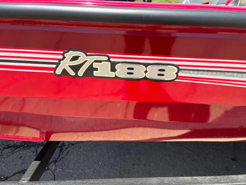 Slide: The Image of 2024 Ranger RT188 boat with red exterior and model branding. - 13