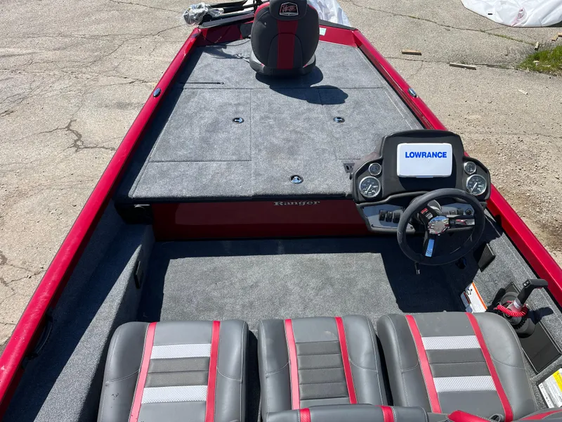 Slide: The Image of 2024 Ranger RT188 boat interior with Lowrance navigation system, red and gray seating. - 3