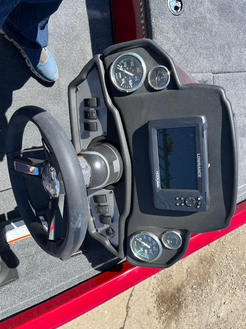 Slide: The Image of 2024 Ranger RT188 boat dashboard with steering wheel and electronic display. - 7