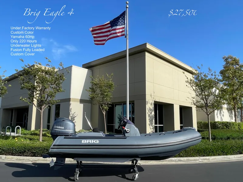 Slide: The Image of 2021 Brig Eagle 4 boat with Yamaha 60HP engine, displayed outdoors under an American flag. - 17