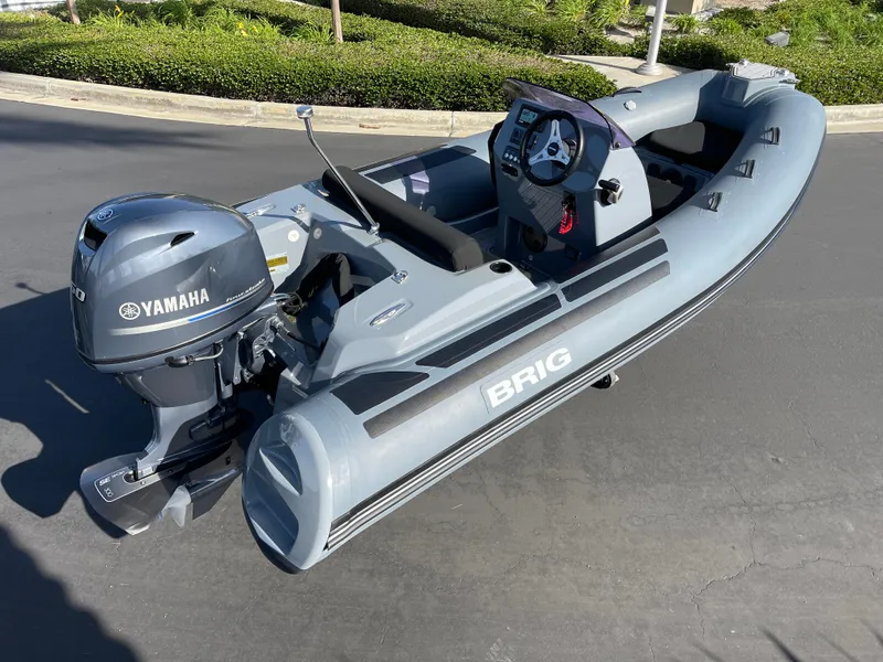 Slide: The Image of 2021 Brig Eagle 4 inflatable boat with Yamaha outboard motor on pavement. - 27