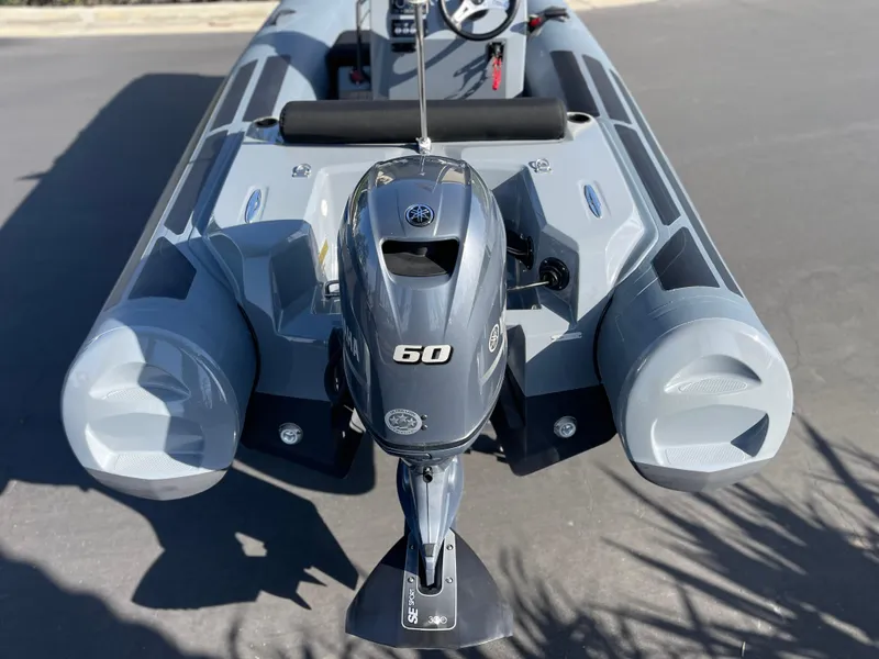 Slide: The Image of 2021 Brig Eagle 4 inflatable boat with 60 HP outboard motor, rear view. - 28