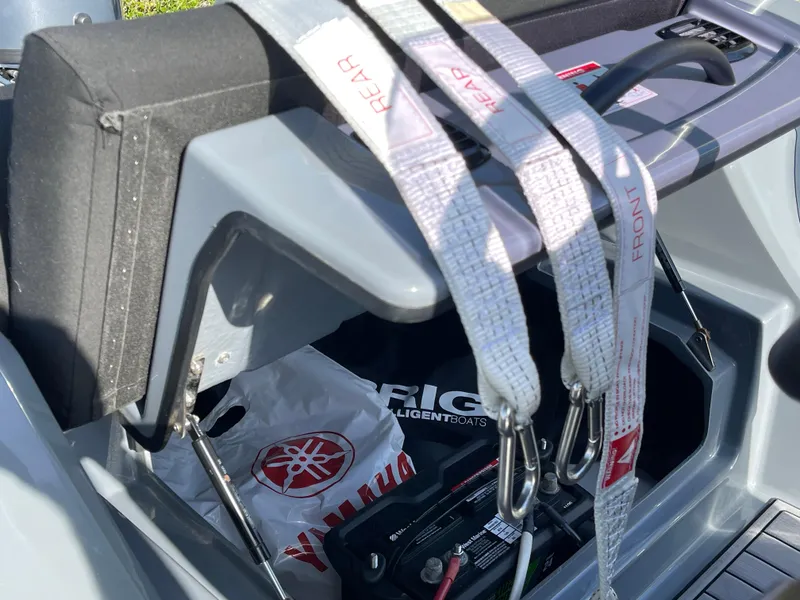 Slide: The Image of 2021 Brig Eagle 4 boat interior with safety straps and storage compartment. - 32