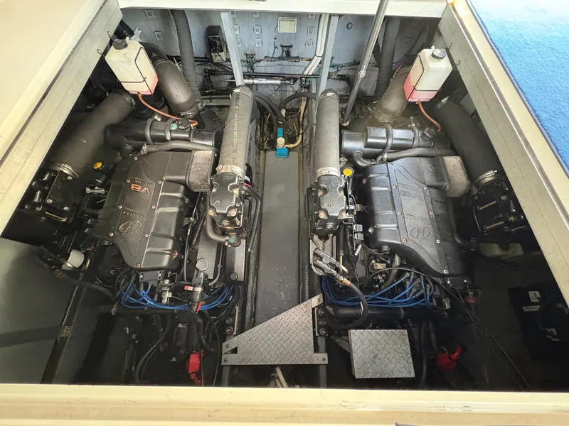 Slide: The Image of Engine compartment of a 1999 Sea Ray 380 Sundancer boat, showcasing dual engines. - 15