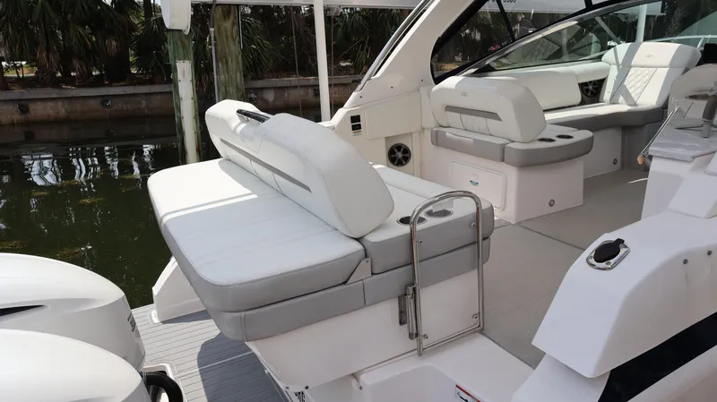 Slide: The Image of 2021 Regal 33 XO boat interior with white seating and modern design. - 20