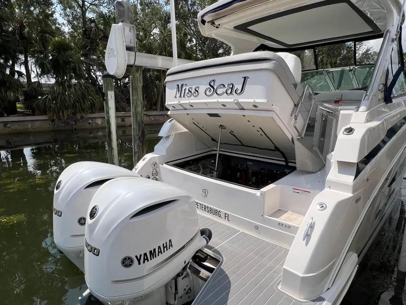 Slide: The Image of 2021 Regal 33 XO boat with Yamaha engines docked, featuring "Miss SeaJ" nameplate. - 23
