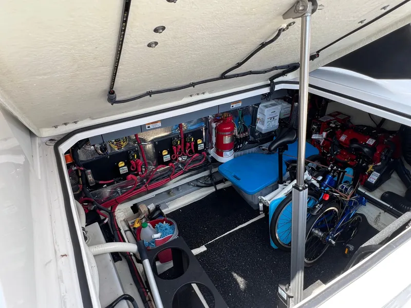 Slide: The Image of Engine compartment of a 2021 Regal 33 XO boat, showcasing wiring and equipment. - 26