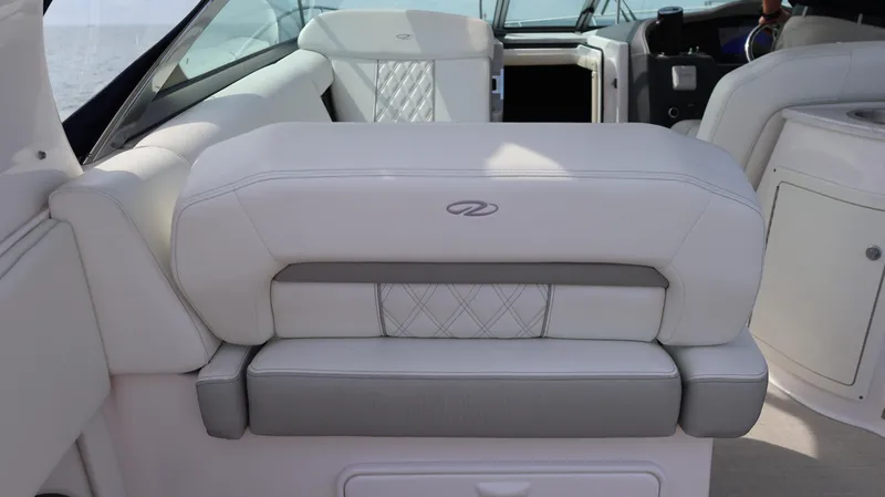 Slide: The Image of 2021 Regal 33 XO boat interior with luxurious white seating and elegant design. - 29