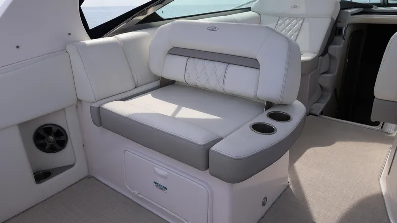 Slide: The Image of Luxurious seating on 2021 Regal 33 XO boat with cup holders and elegant design. - 31