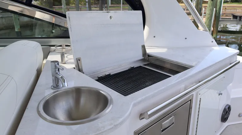 Slide: The Image of 2021 Regal 33 XO boat with outdoor sink and grill station. - 36