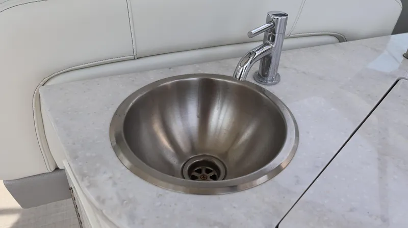 Slide: The Image of Stainless steel sink on 2021 Regal 33 XO boat with modern faucet. - 37