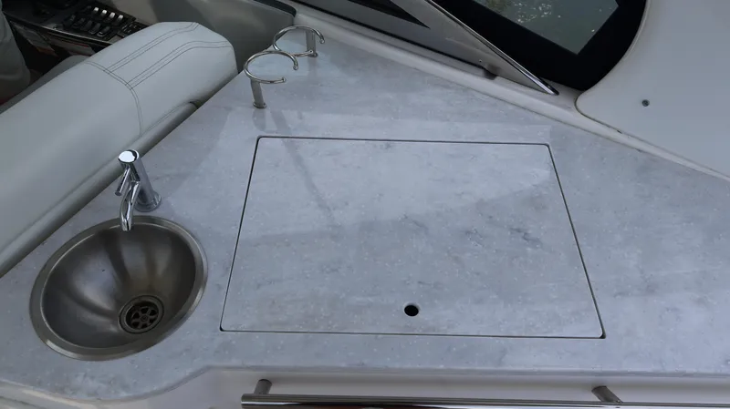 Slide: The Image of 2021 Regal 33 XO yacht kitchenette with sink and countertop. - 38