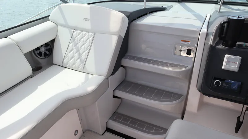 Slide: The Image of 2021 Regal 33 XO boat interior with white seating and steps. - 47