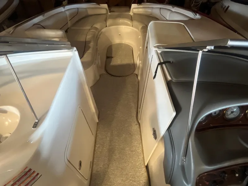 Slide: The Image of 2002 Ebbtide 2400 Mystique boat interior with seating and dashboard view. - 10