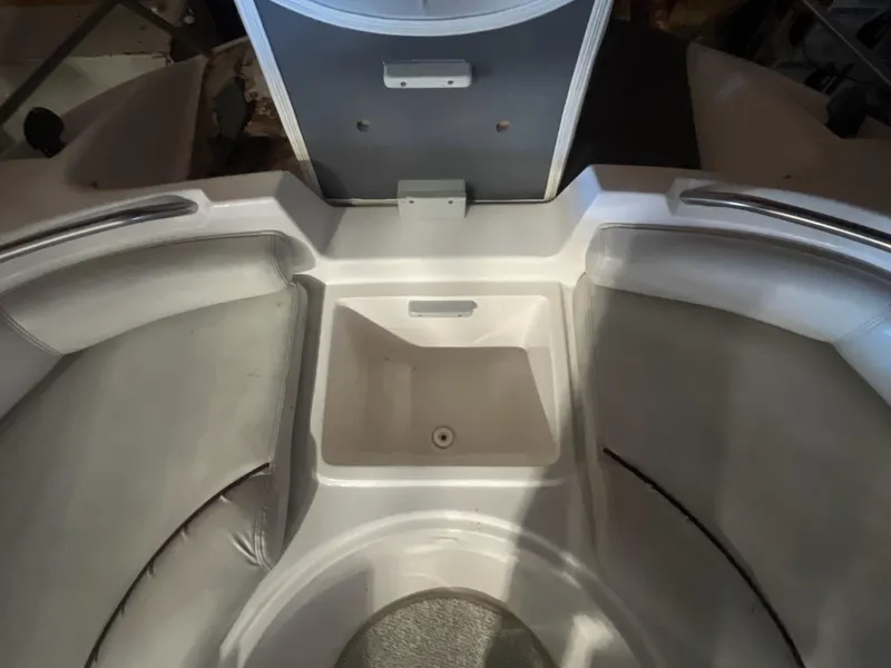 Slide: The Image of Interior view of 2002 Ebbtide 2400 Mystique boat, featuring seating and storage area. - 15