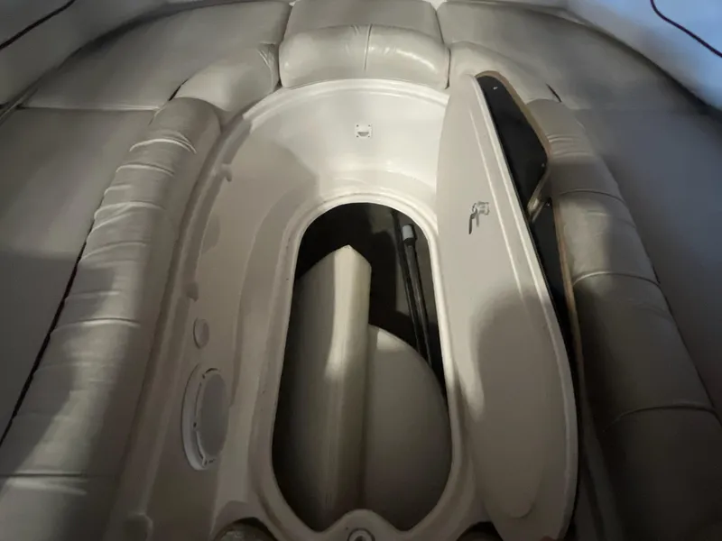 Slide: The Image of 2002 Ebbtide 2400 Mystique boat interior with open storage compartment. - 16