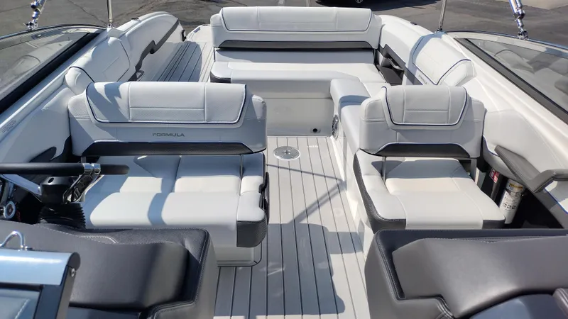 Slide: The Image of Luxurious seating on 2026 Formula 270 Bowrider boat, featuring sleek white and black upholstery. - 18