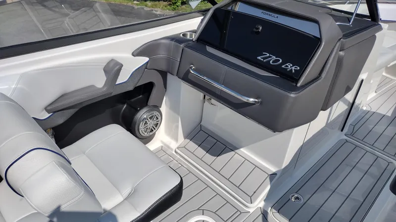 Slide: The Image of 2026 Formula 270 Bowrider interior with luxurious white seating and modern design. - 21