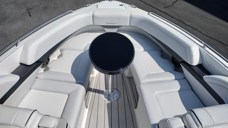 Slide: The Image of 2026 Formula 270 Bowrider boat in a warehouse setting, front view. - 39