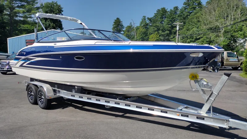 Slide: The Image of 2026 Formula 270 Bowrider boat on trailer, sleek design, parked outdoors. - 4