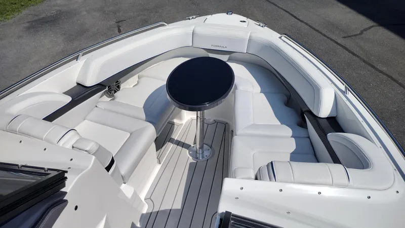 Slide: The Image of 2026 Formula 270 Bowrider boat in a warehouse, rear view. - 40