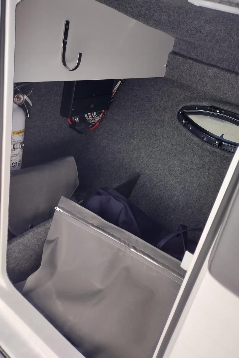 Slide: The Image of 2026 Formula 270 Bowrider boat with sleek design and spacious seating in a garage setting. - 55