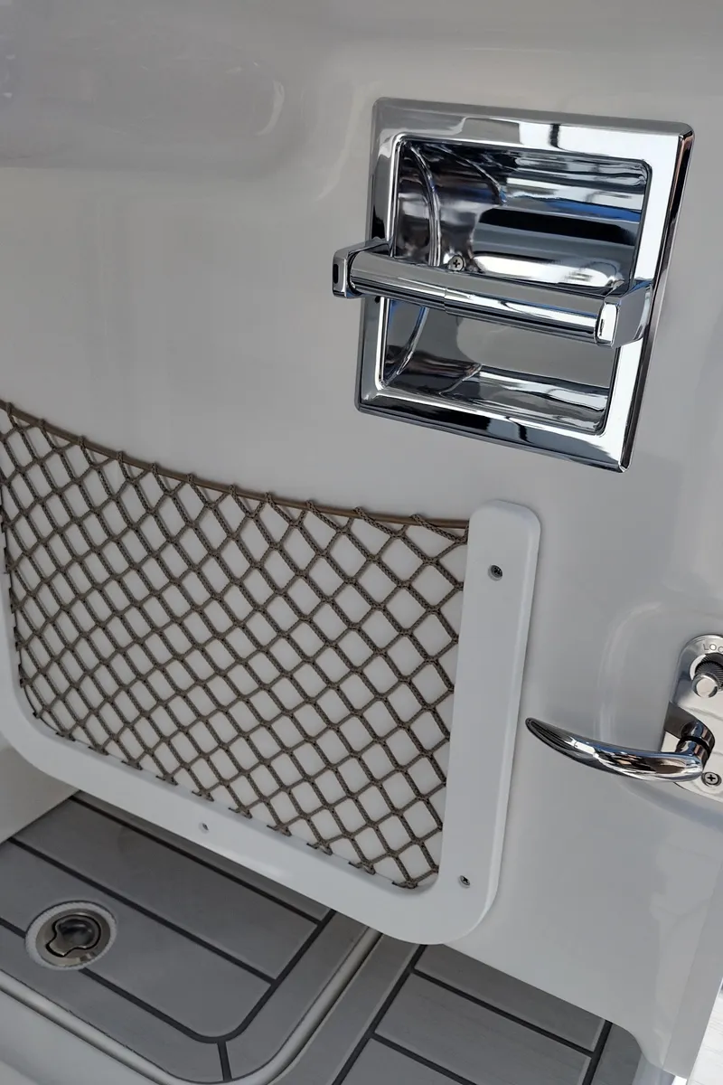 Slide: The Image of Interior storage compartment of 2026 Formula 270 Bowrider boat with wiring and a cardboard box. - 60