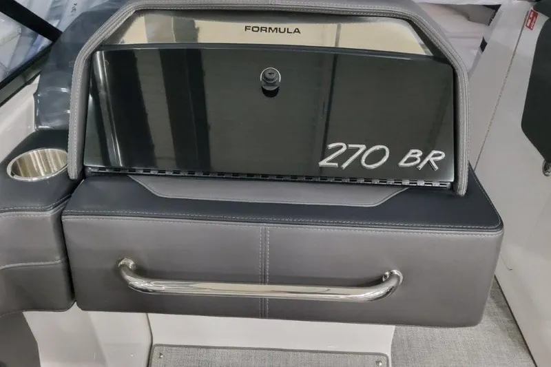 Slide: The Image of 2026 Formula 270 Bowrider dashboard with cup holder and sleek design. - 65