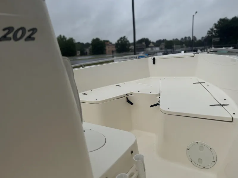 Slide: The Image of 2003 Sea Hunt 202 TRITON boat interior with seating and storage compartments. - 12