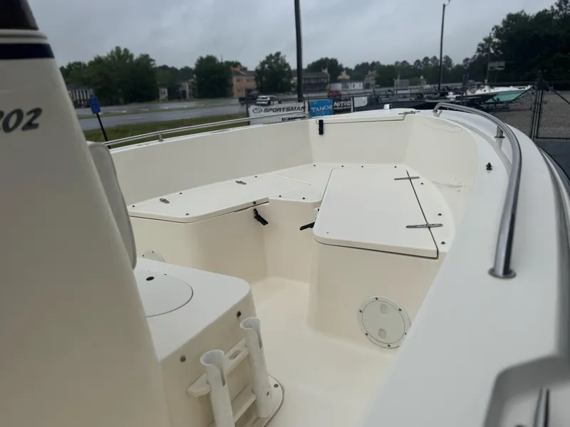 Slide: The Image of 2003 Sea Hunt 202 TRITON boat interior, featuring spacious seating and storage compartments. - 13