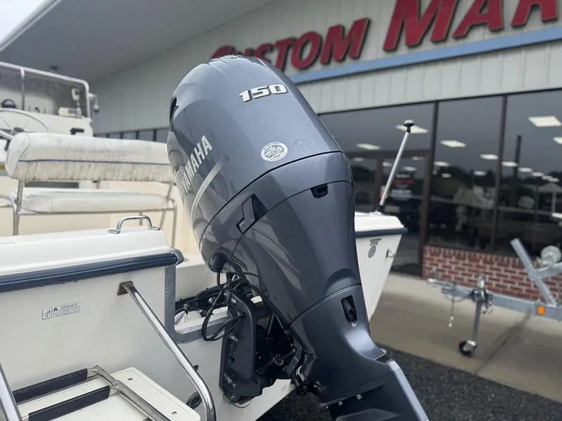 Slide: The Image of 2003 Sea Hunt 202 TRITON boat with Yamaha 150 outboard motor at dealership. - 4