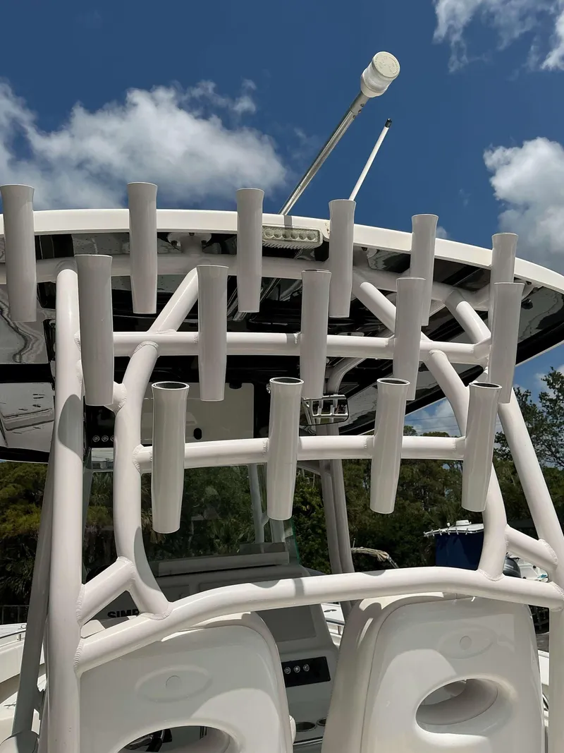 Slide: The Image of 2017 Cape Horn 36 XS boat with rod holders under a clear blue sky. - 13